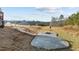 Spacious backyard featuring a concrete patio with firepit area and stairway leading up to the house at 40 Cinnamon Teal Way, Youngsville, NC 27596