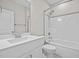 A bright bathroom includes a vanity sink with good cabinet space, a toilet, and a tub shower at 40 Cinnamon Teal Way, Youngsville, NC 27596