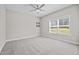 Cozy bedroom features a neutral wall color, and window to filter in natural light at 40 Cinnamon Teal Way, Youngsville, NC 27596