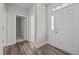 Welcoming foyer featuring durable floors and an attractive front door with sidelights at 40 Cinnamon Teal Way, Youngsville, NC 27596