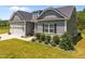 Charming home with three-car garage and well-manicured lawn and professional landscaping at 40 Cinnamon Teal Way, Youngsville, NC 27596