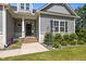 Inviting front porch with brick steps and decorative landscaping for a welcoming entrance at 40 Cinnamon Teal Way, Youngsville, NC 27596