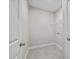 A well-lit laundry room with a wire rack above hookups at 40 Cinnamon Teal Way, Youngsville, NC 27596