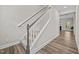 The staircase is carpeted and trimmed with white and gray paint at 40 Cinnamon Teal Way, Youngsville, NC 27596