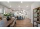 Open dining area flows into a modern kitchen with an island and pendant lighting above at 40 Eagle Crest Ct # Clayton Low Country, Lillington, NC 27546