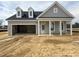 A charming single-Gathering home featuring light gray siding, a dark roof, and an attached two-car garage at 40 Eagle Crest Ct # Clayton Low Country, Lillington, NC 27546