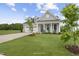 A single-Gathering home boasts light gray siding and a well-maintained lawn with a tree-lined front yard at 40 Eagle Crest Ct # Clayton Low Country, Lillington, NC 27546
