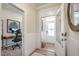 Bright foyer with an open doorway to an office, wood flooring, and white wainscoting at 40 Eagle Crest Ct # Clayton Low Country, Lillington, NC 27546