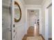 Hallway view of a foyer featuring wood floors, neutral walls with white trim, and modern light fixtures at 40 Eagle Crest Ct # Clayton Low Country, Lillington, NC 27546