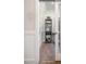 Hallway with a view of a modern office, wood floor, and white walls at 40 Eagle Crest Ct # Clayton Low Country, Lillington, NC 27546