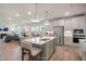 Open-concept kitchen with a large island, modern appliances, and seamless access to the living room at 40 Eagle Crest Ct # Clayton Low Country, Lillington, NC 27546