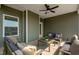 Inviting covered patio with comfortable seating and a ceiling fan for relaxing outdoors at 40 Eagle Crest Ct # Clayton Low Country, Lillington, NC 27546