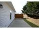Exterior backyard view of a patio area with vinyl siding and mature trees at 407 Misty Grove Cir, Morrisville, NC 27560