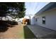 View of the backyard featuring a patio, green grass and mature trees at 407 Misty Grove Cir, Morrisville, NC 27560