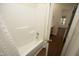 Bright bathroom featuring a shower and tub combination with modern fixtures at 407 Misty Grove Cir, Morrisville, NC 27560