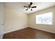 Bedroom with a large window and ceiling fan with vinyl floors at 407 Misty Grove Cir, Morrisville, NC 27560