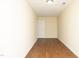 Bedroom featuring hardwood flooring, fresh paint and a door leading to a closet at 407 Misty Grove Cir, Morrisville, NC 27560