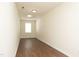 Bright bedroom featuring wood flooring, a window for natural light and neutral wall color at 407 Misty Grove Cir, Morrisville, NC 27560