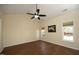 A spacious bedroom features a ceiling fan, two windows and neutral paint at 407 Misty Grove Cir, Morrisville, NC 27560