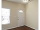 Bright entryway features wood flooring and white trim and a window for ample light at 407 Misty Grove Cir, Morrisville, NC 27560
