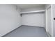 A garage with a gray epoxy floor and a white door at 407 Misty Grove Cir, Morrisville, NC 27560