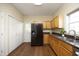 Well-equipped kitchen with stainless steel refrigerator, and granite countertops at 407 Misty Grove Cir, Morrisville, NC 27560