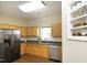 Bright kitchen features granite countertops, stainless steel appliances and ample storage space at 407 Misty Grove Cir, Morrisville, NC 27560