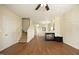 Inviting living room with a modern fireplace, sleek wood floors, and an open staircase at 407 Misty Grove Cir, Morrisville, NC 27560