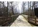 View of a walking path surrounded by mature trees at 407 Misty Grove Cir, Morrisville, NC 27560