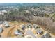 Aerial perspective of houses nestled among trees, showcasing community layout at 474 W Ravano Dr, Clayton, NC 27527