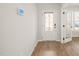 Bright foyer with hardwood floors and access to a study featuring glass French doors at 474 W Ravano Dr, Clayton, NC 27527