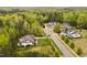 An aerial view of a neighborhood featuring manicured lawns and mature trees at 5040 Shakori Trl, Chapel Hill, NC 27707