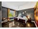 Comfortable bedroom with two twin beds, window views, and rich dark floors for relaxing retreat at 5040 Shakori Trl, Chapel Hill, NC 27707