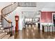 Stunning foyer with a curved staircase, hardwood floors, and an open view to the spacious living area at 5040 Shakori Trl, Chapel Hill, NC 27707