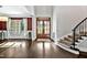 Beautiful foyer featuring hardwood floors, a staircase, and a view into the dining room at 5040 Shakori Trl, Chapel Hill, NC 27707