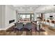 Spacious living room featuring hardwood floors, a modern fireplace, and an open concept design at 5040 Shakori Trl, Chapel Hill, NC 27707
