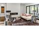 Comfortable living room with a sleek fireplace, hardwood floors, and a sliding glass door at 5040 Shakori Trl, Chapel Hill, NC 27707