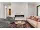 Sophisticated living room featuring a modern fireplace, stylish seating, and elegant decor at 5040 Shakori Trl, Chapel Hill, NC 27707