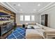 Spacious living room featuring modern rustic accent wall, recessed lighting, and large sectional sofa at 5040 Shakori Trl, Chapel Hill, NC 27707