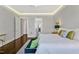 The main bedroom offers ample space, dark hardwood floors, and a serene view at 5040 Shakori Trl, Chapel Hill, NC 27707