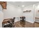 Bright home office featuring wooden desks, hardwood floors, floating shelves, and white trim at 5040 Shakori Trl, Chapel Hill, NC 27707
