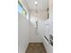 Bright shower with unique textured walls, and a rainfall shower head at 5040 Shakori Trl, Chapel Hill, NC 27707