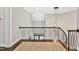 The staircase offers a stylish modern design with decorative black metal railing and hanging light fixture at 5040 Shakori Trl, Chapel Hill, NC 27707
