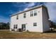 Backyard view of home with a cozy patio area for outdoor relaxation at 505 Marthas View Way, Wake Forest, NC 27587