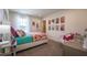 Bright bedroom featuring stylish decor, a large window, and comfortable furnishings at 505 Marthas View Way, Wake Forest, NC 27587