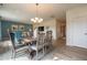 Dining room and living room featuring hardwood floors, modern decor, and a stylish dining set at 505 Marthas View Way, Wake Forest, NC 27587