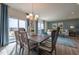 Elegant dining room with stylish chairs, chandelier lighting, and access to the backyard at 505 Marthas View Way, Wake Forest, NC 27587