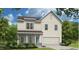 Charming new construction home with a two-car garage, inviting entry, and manicured landscaping at 505 Marthas View Way, Wake Forest, NC 27587