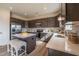 Bright kitchen featuring stainless steel appliances, gray cabinets, and a kitchen island with seating at 505 Marthas View Way, Wake Forest, NC 27587