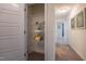 A well-organized linen closet with white shelving provides ample storage space in a bright hallway at 505 Marthas View Way, Wake Forest, NC 27587